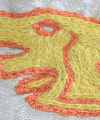 Detail from an embroidery design completed in naturally dyed wool yarns coloured with madder and weld